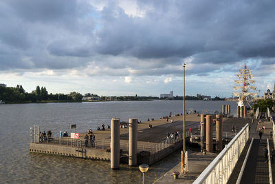 Pier over river against sky