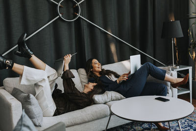 Young couple sitting on sofa