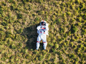 Full length of woman standing on field