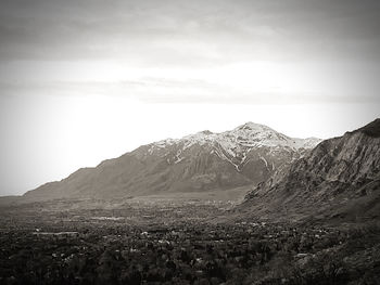 Scenic view of landscape and mountains against sky
