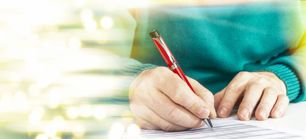 Close-up of woman working on table