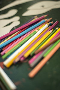 Close-up of colorful pencils on table