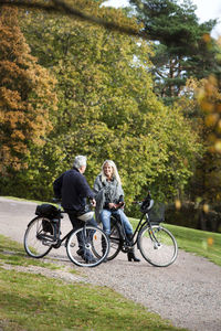 Senior couple cycling, delsjon, gothenburg, sweden