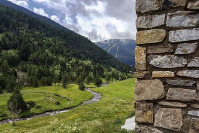 Scenic view of green mountains against sky