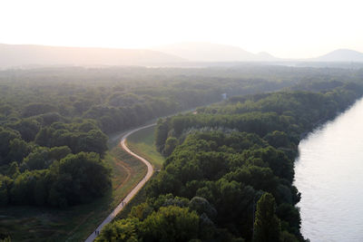 High angle view of green landscape against sky