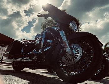 Low angle view of bicycle on road against sky