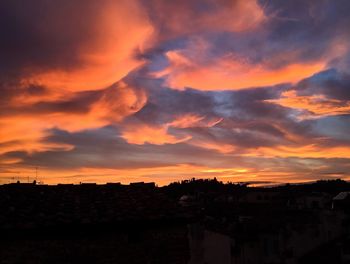 Scenic view of dramatic sky at sunset