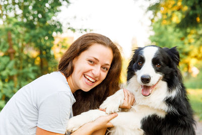 Portrait of young woman with dog