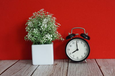 Directly above shot of alarm clock on table