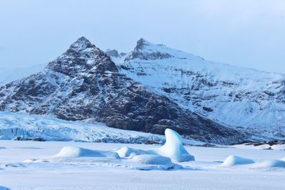 Scenic view of snowcapped mountains against sky