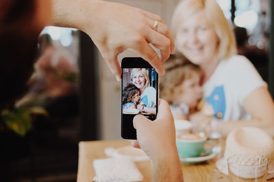 Midsection of woman using mobile phone