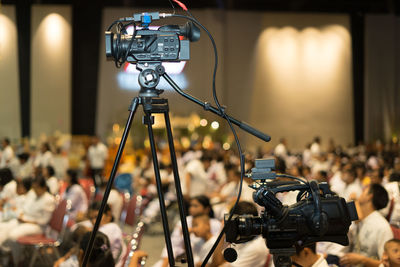 Low angle view of television camera in auditorium