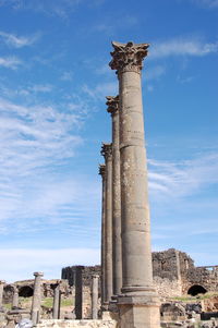 Low angle view of old ruin building against sky