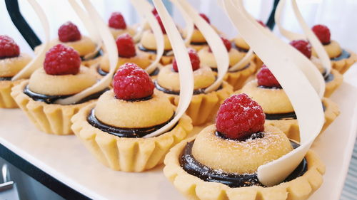 Close-up of decorated desserts served on table