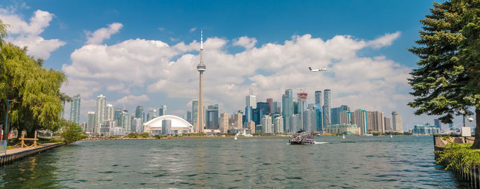 Panoramic view of river and buildings against sky
