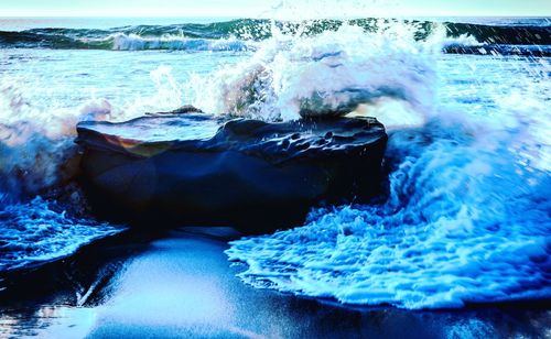 Close-up of waves splashing in sea