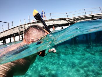 Man swimming in pool