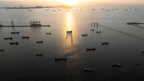 High angle view of boats in sea during sunset