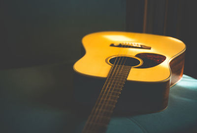 Close-up of guitar on table