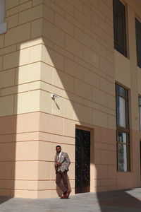 Businessman standing outside building