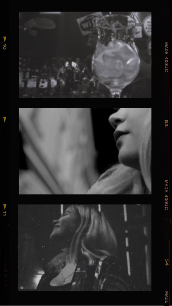 CLOSE-UP OF WOMAN LOOKING THROUGH WINDOW