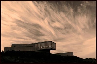 Built structure against cloudy sky