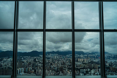 Buildings in city seen through window