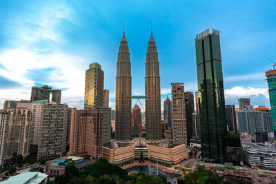 Buildings in city against sky