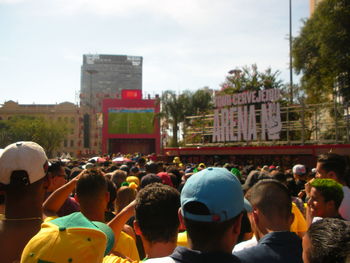 Group of people in front of buildings