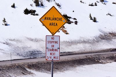 Information sign on snow covered road