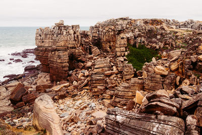 View of rock formations in sea