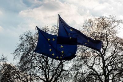 Low angle view of flag against sky