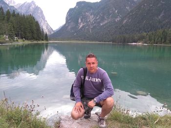 Man relaxing on lakeshore