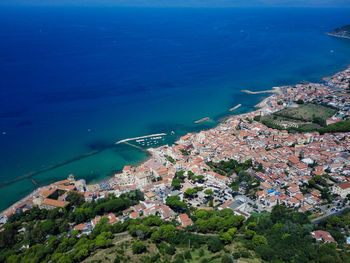 High angle view of townscape by sea