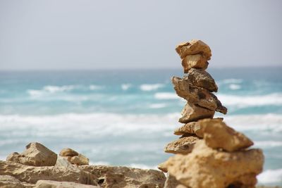 Stack of rocks against sea