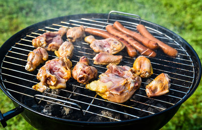 Close-up of meat on barbecue grill