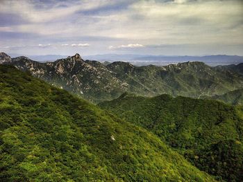 Scenic view of landscape against cloudy sky