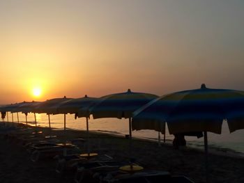 Scenic view of beach against sky during sunset