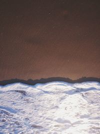 Scenic view of sea against sky during winter