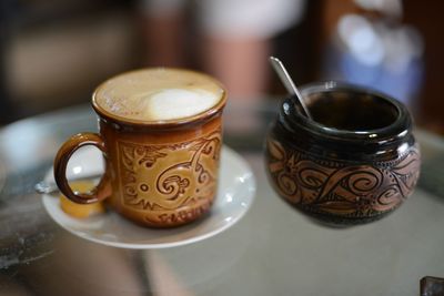 Close-up of coffee cup on table