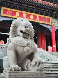 Close-up of statue against temple
