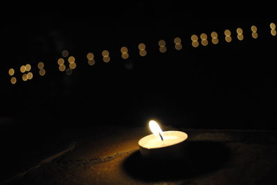 Lit candles in temple
