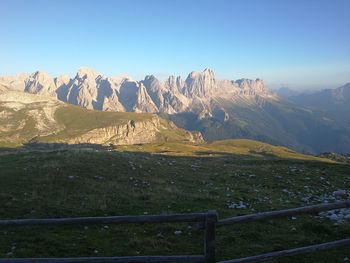 Scenic view of mountains against clear blue sky