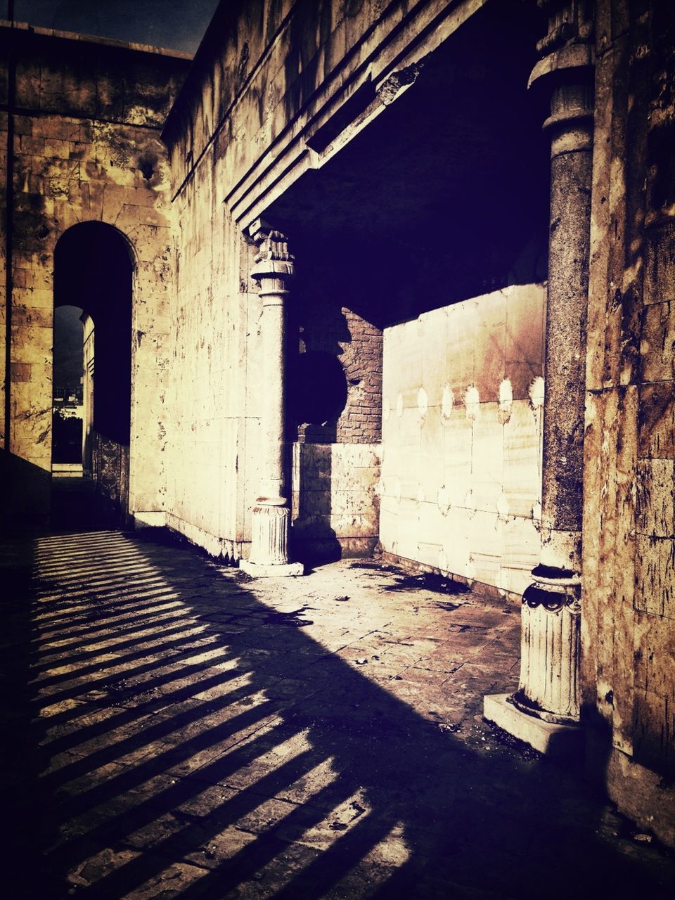 architecture, built structure, building exterior, history, arch, old, the way forward, building, stone wall, steps, indoors, old ruin, ancient, sunlight, shadow, architectural column, the past, historic, narrow, corridor