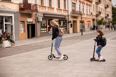 Women walking on street in city
