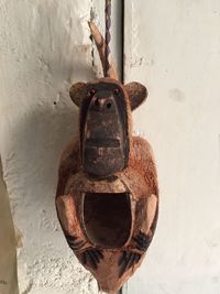 Close-up of rusty hanging on wall