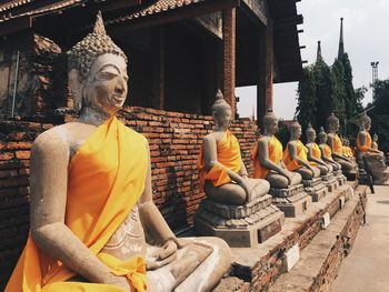 Statue against temple