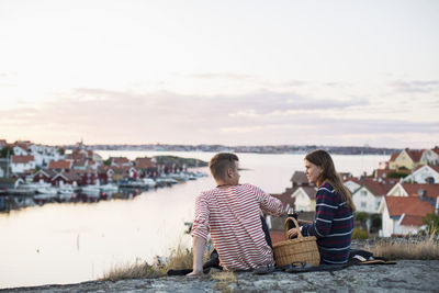 Young couple relaxation by lake