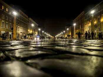 Surface level of wet street at night