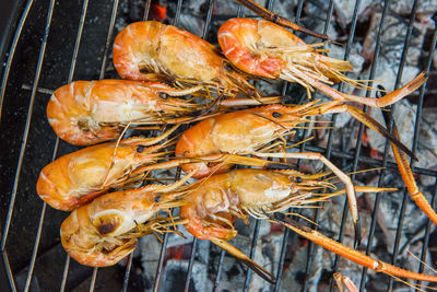 High angle view of meat on barbecue